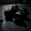 Placeholder: Hexagon dumbbells pair of two, each 12.5KG. Inside a dark and moody gym on the black rubber tile floor. Bird perspective on the dumbbells laying on the floor.