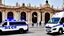 Placeholder: A police Tesla Cybertruck is chasing a Tesla 'Model S Plaid' at top speed, across the 'Plaza de la Constitución', in the city of Mexico. CINEMATIC. WIDE ANGLE LENS. PHOTO REAL.