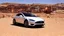 Placeholder: A Tesla's 'Model S Plaid' is racing at top speed, at Petra, in Jordan. CINEMATIC. WIDE ANGLE LENS.