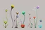 Placeholder: Isolated concept art of alien plants on a plain neutral background. Strange fictional extraterrestrial flora with unusual shapes, glowing details, thorns, spines, tendrils, and exotic flowers. Each plant designed with unique silhouette and fantasy colors, digital painting style, detailed textures, science fiction botanical illustration, no background, no landscape.