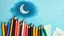 Placeholder: A bunch of colored pencils and some child drawings and a crescent moon image above the image on a light and dark blue background, amazing and poetic.