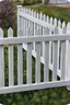 Placeholder: white vinyl fence in yard, photograph