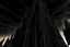 Placeholder: A twisted, dark, cathedral/tower stretching into a cracked sky