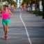 Placeholder:  old Sonia Lombardi running a marathon on Miami beach, full body, about to cross the finish line, photo realistic, 8k, realism