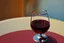 Placeholder: cup of red wine on a table