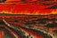 Placeholder: A dark red town with a fiery arena painted by Utagawa Hiroshige