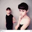 Placeholder: Russian short hair beautiful tomboy boyish boylike short man's haircut boyish features shortcut in black girlish nightgown in hotel