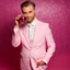 Placeholder: man in a pink suit, glam style and a glass of red wine in his hand, pink background too, real photography, portrait photography