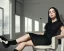 Placeholder: Billie Eilish, sitting on a chair, Black Short Dress, high detail, realistic, 8k