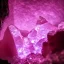 Placeholder: single pink crystal, on an altar in a foggy cave