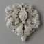 Placeholder: ivory brooch of a rose, opalescent marble carving, decorative design, classical ornament, highly ornate, highly intricate, highly detailed etching, marble carving, warm lighting, black linen backdrop