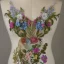 Placeholder: bodice with delicate embroidery and beadwork of flowers, couture, beautiful composition, aesthetic layout, wildflowers, watercolor