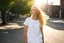 Placeholder: outside of a mundane American town, she is standing on the edge of the sidewalk, a young blonde girl with an air of intrigue. The sunlight dances upon her golden hair, casting a radiant halo around her delicate features. Your gaze is drawn to her attire—a pristine white t-shirt that clings to her slender form, paired with a long, flowing yellow satin skirt that sways gently with the breeze.