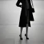 Placeholder: A tall slender young woman with short hair and a black trench coat longingly waiting for a lover at an airport