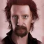 Placeholder: Portrait of Courtney Gains as a ruggedly handsome but joyful roguish pirate, charismatic, attractive male, masculine, perfect, precisely detailed, lightly freckled face, meticulously detailed multi-hued ginger carrot colored cherry fire red hair; Malachai of the corn; fantasy, intricate, elegant, highly detailed, digital painting, artstation, concept art, matte, sharp focus, illustration, art by artgerm and greg rutkowski and alphonse mucha