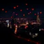 Placeholder: a romantic city view at night, red vibes