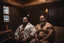 Placeholder: full body shot photography, two muscular chubby ugly burly marocan men , sweat, bulge, masculine hairy 43 year old man, curly hair, manly chest, curly beard ,big shoulders, big arms, big legs, bulge,, ambient occlusion , lying down sleeping in a steamy Sauna, super high resolution, 8k, dim light, side light, ultra hyper realistic, frontal view