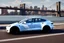 Placeholder: A Tesla 'Model 3' is going at a high speed, on the 'FDR Drive', eastern Manhattan. (CINEMATIC, WIDE ANGLE LENS, PHOTO REAL)