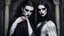 Placeholder: vampire goth fashion, women and men in pale face, black make up, black hair, long pointed dark nails, full body photo, Renaissance goth clothes style , High detailed, sharp focus, looking at the camera, cinematic, masterpiece, high realistic, fashion photo