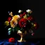 Placeholder: Flowers in midnight blue flowers, red flowers and green leaves in a gold vase. Light background