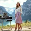Placeholder: very beautiful lady with beautiful midi skirt and blouse standing in Swiss country side next to pretty mountains with high heels next to makeup desk looking to camera