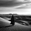 Placeholder: desert landscape cloaked figure black and white