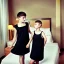 Placeholder: Russian short hair beautiful tomboy boyish boylike short man's haircut boyish features shortcut in black girlish nightgown in hotel