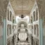 Placeholder: opulent and luxurious pale seafoam and white color mediterranean revival style hall; view from the huge central hall looking up at the building