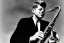 Placeholder: Lonely John f kennedy playing A normal saxophone with his eyes closed