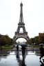 Placeholder: around Eiffel tower a few people with umbrella walking while it is raining and the Eiffel is seen complete