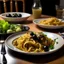 Placeholder: A dining table on which there is fast food pasta with black olives on it and also a plate of green olives