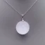 Placeholder: Clear polyester necklace with a simple, elegant design featuring a single, shimmering crystal pendant