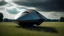 Placeholder: small, sleek, squat, cargo spaceship shaped like a manta ray, sitting in a field