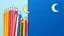 Placeholder: A bunch of colored pencils in the middle of the image and some children's drawings and a crescent moon image at the top of the image on a light and dark blue background.