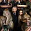 Placeholder: DARK HAIR PRESIDENT of poland TAKING A PHOTO WITH MONKEYS, MUSHROOMS IN THE BACK