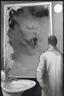 Placeholder: a man looking into a shattered bathroom mirror and seeing a horrifying, abstract deranged monster in his reflection
