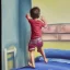 Placeholder: Painting of a little boy jumping on the bed