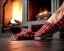 Placeholder: Red plaid slippers on black bearskin rug,log cabin walls, stone fireplace