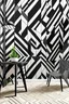 Placeholder: Create a hand-painted mural with bold zigzag lines in a monochromatic palette, creating a dynamic and visually striking pattern for a modern and energetic space