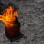 Placeholder: fire with shadow in the old bottle with water