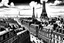 Placeholder: ciudad de paris vista panorámica en blanco y negro . estilo comic. . vista panoramica frontal puedes hacerlo mejor. chimeneas con humo. clave tonal baja. más ejemplos. linea de horizonte más baja. vista desde abajo. vista desde la calle