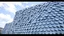 Placeholder: Kinetic façade of a museum, made of thousands of steel and glass scales that shift with the wind.