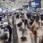 Placeholder: photo of a young beautiful model posing and smiling on the dow jones trading floor with bankers busy working in the background, balenciaga, photorealistic, colourful, high contrast, dow jones, trading floor, fashion photography, high resolution, 8k, hard light, gen z, wide angle lens