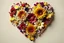 Placeholder: heart shape out of realistic autumn and winter flowers on nice background