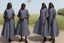 Placeholder: 4 suore africane con tunica grigia figura intera fino ai piedi