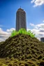 Placeholder: skyscraper sprouting from dirt