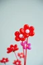 Placeholder: plastic balloon flowers, red bacground