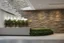 Placeholder: Modern stone wall, museum reception