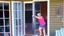 Placeholder: lady upset with door installer when screen door is too big and won't fit in the framing