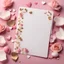 Placeholder: A photo of a white card, 5.5 by 4.25 inches. The card is vertically positioned on a beautiful light pink surface, positioned between pink rose petals and litte golden hearts.